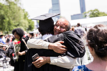 Parent embraces MIT graduate
