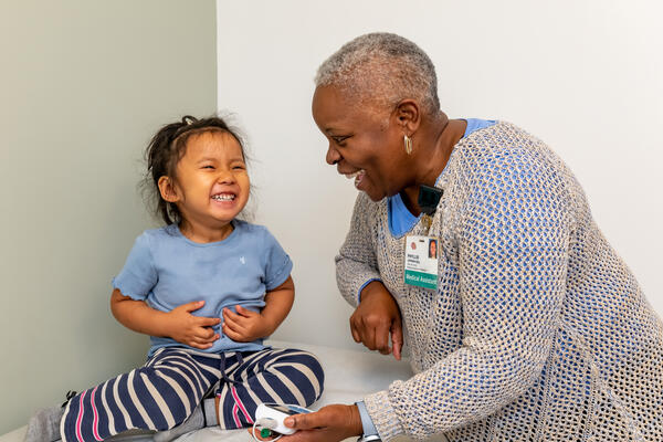 Nurse smiles with young patient